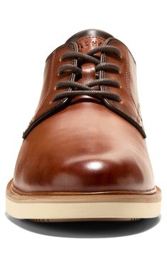 Classic, casual and easy to wear, this versatile derby features a plain toe for simplicity and cushy rubber in the sole for all-day comfort. Lace-up style Leather upper/textile lining/rubber sole Imported Casual Brown Dress Shoes With Contrast Sole, Casual Cap Toe Dress Shoes With Stitched Sole, Casual Brown Cap Toe Lace-up Shoes, Casual Lace-up Shoes With Cap Toe And Rubber Sole, Derby Low-top Lace-up Shoes With Leather Footbed, Casual Oxfords With Leather Footbed And Plain Toe, Casual Moc Toe Oxfords For Derby, Casual Oxfords With Textured Sole And Plain Toe, Casual Plain Toe Oxfords With Leather Footbed