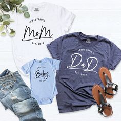 "Family Matching Est. Shirt, Custom Family Name, Mama dada baby outfit, Birthday Family shirt, Baby shower party, Baby Announcement Shirt, Mom and Dad Est. Shirt , Daddy Mommy Couple Shirt, Mom Est. Shirt, Dad Est. Shirt, New Dad Shirt, New Mom Shirt, Family Matching Est. Shirt. HI! Welcome to my store, I'm delighted to see you here. My store's main goal is to provide you with premium everyday apparel with the best graphic t-shirts. I see you as a friend, not just a customer. I'm sure you'll lov Family Matching Shirt With Name Print For First Birthday, Customizable Family Matching T-shirt For First Birthday, Family Matching T-shirt With Name Print For First Birthday, Family Matching Shirt With Name Print For Father's Day, Family Matching Name Print T-shirt For First Birthday, Family Matching T-shirt For First Birthday And Father's Day, Family Matching Personalized Blue T-shirt, Blue T-shirt For Gender Reveal On Father's Day, Family Shirt With Custom Print For Father's Day