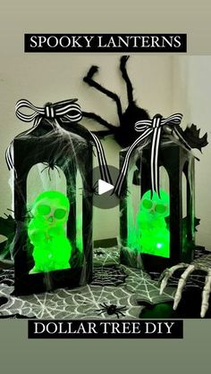 two green halloween lanterns sitting on top of a table