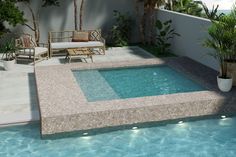 an outdoor pool with lounge chairs and potted plants