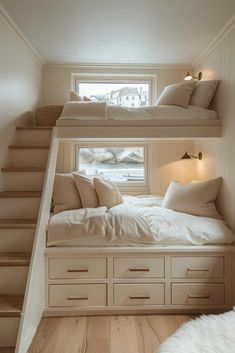 bunk beds are built into the side of each other in this small room with white walls and wood flooring