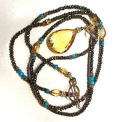 "Large Briolette-cut Citrine Quartz, Golden Yellow, 32.5\" Long Necklace, Pyrite, Sleeping Beauty Turquoise, Vermeil Toggle Clasp, Small Citrines, One-of-a-Kind This large, 25 carat, citrine quartz briolette was hand-cut by my favorite Brazilian stonecutter, Lano.  It is approximately 1 1/4 X 3/4 inches. It is near perfect with only a couple of minute natural  inclusions typical of citrine. It hangs on a 32.5-inch long rope of faceted iron pyrite beads, interspersed with sleeping beauty turquois Gold Gemstone Necklace, November Birthstone Jewelry, Briolette Necklace, Necklace Big, Iron Pyrite, Long Rope, Citrine Jewelry, Citrine Beads, Chakra Necklace