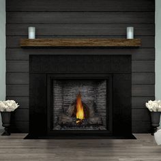 a fire place with two vases on either side