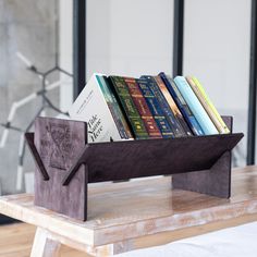 a wooden book stand with books in it