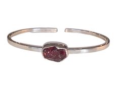 Accentuate any ensemble with a stunning and unique Single Gemstone Sterling Silver Bangle Bracelet; choose from Garnet, Pyrite or K2 Jasper. This one-of-a-kind piece is crafted from sterling silver and adorned with a single precious gemstone. Available in an assortment of stones, each bangle fits comfortably around the wrist while completing your outfit with a touch of luxury. Perfect as a gift or just to treat yourself, this bracelet makes an elegant statement of style and sophistication. Explo Silver Cuff Bangle, Sterling Silver Bangle Bracelets, Metallic Luster, Crystal Bangle, Stone Bangle, Cuff Bangle Bracelet, Bangles Style, Fool Gold, Silver Bangle Bracelets