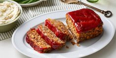 two slices of meatloaf on a plate with mashed potatoes