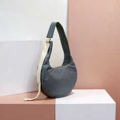 "The Moon Shaped Bag is a versatile and unique bag. It is easily carried both as a shoulder bag and as a cross body bag by simply adjusting the buckle on the strap. The bag could be sewn out of a variety of different fabrics and materials to fit your specific needs. It is medium in size and can contain your everyday belongings. The bag is called \"moon-shaped\" since it is designed in the shape of a crescent moon, which allows the utmost comfortable positioning and shape in order to carry it aro Crescent Bag Pattern, Sewn Handbags, Unique Crossbody Bag, Shopping Bag Pattern, List Of Tools, Handbag Pattern, Oversized Bag, Tutorial Crochet, Summer Bag