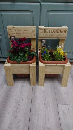 two wooden planters sitting on top of each other