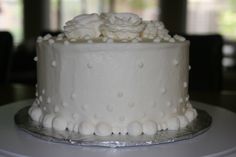 a close up of a white cake on a table