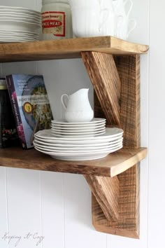 a wooden shelf with plates and cups on it