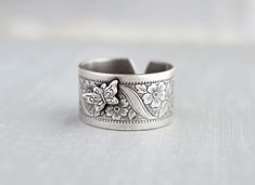 "Unique Butterfly Ring. Oxidized sterling silver plated. Ring band is 11mm wide. This ring is adjustable and fits a size 6-9 best. Visit my shop today to see other great items. :) http://www.etsy.com/shop/WearitoutJewelz ♥I LOVE custom orders. :) I will gladly make any matching earrings, hair pins, necklaces, rings, bracelets, etc. to your preference. Just contact me via conversations. I can also adjust chain lengths or switch out earring hooks, free of charge. Just leave me a note with your pre Adjustable Wide Band Open Ring For Gift, Adjustable Open Band Wide Ring For Gift, Stamped Wide Band Jewelry Gift, Stamped Wide Band Jewelry For Gift, Adjustable Silver Wide Band Ring As Gift, Gift Jewelry With Stamped Wide Band, Adjustable Wide Band Ring Gift, Vintage Sterling Silver Wide Band Ring Gift, Unique Butterfly