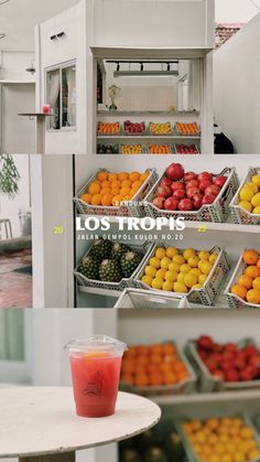 there are many different types of fruits in the display case and on the table next to each other