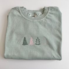 Simple and sweet! 4 simple trees are embroidered in blush and dark sage on this short sleeve comfort colors tee. Oversized Shirt For Women, Simple Tree, Dark Sage, Tee Tree, Embroidered Tee, Colorful Christmas Tree, Comfort Colors Tee, T Shirt Oversized, Christmas T Shirt