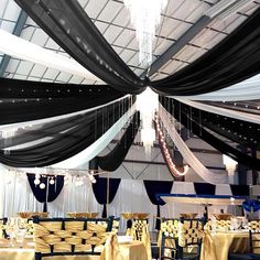 a banquet hall with black and white draping