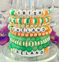 a stack of bracelets with the words irish and ireland written on them in different colors