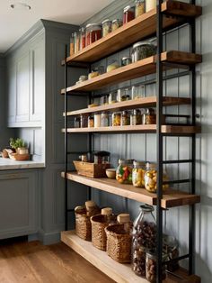 a kitchen with shelves filled with lots of food