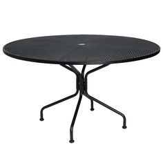 a round table with black metal legs and a circular top, on an isolated white background