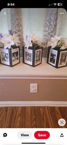 three small vases with flowers in them on a shelf