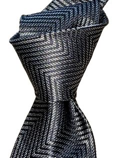 For sale:  A NWT $280 woven silk tie by TOM FORD.  One of the premier designers of our generation.  Former director of Gucci, the patterns are unique and luxurious. Designer for the clothing worn in current James Bond movies. Wear it for those occasions where you need to look your best. Details: NWT $280  Colors:  Charcoal gray Pattern:  Zig Zag Width:  3.6" Length:  59" Weight: Medium Self tipped Tie keeper Fabric:  Woven silk  Origin:  Italy **Please note - you are dealing with a retailer with over 15 years of selling experience.  Please buy with confidence.  Loc: Fl2- James Bond Movies, Bond Movies, Our Generation, Silk Necktie, Grey Pattern, James Bond, Charcoal Gray, Silk Ties, Zig Zag