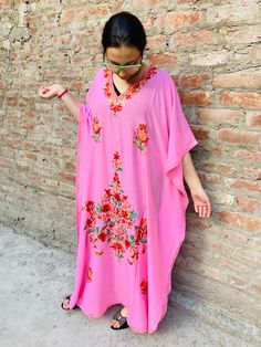 Our gorgeous high quality boho maxi dress kaftan combines 100% fine cotton with stunning Kashmiri embroidery. The embroidery is in the neckline and over the body, with a smaller embroidered detail on the back. Best choice for the summer, you can wear this model for plenty of occasions, morning to evening. Feels comfortable, chic and cool. The best choice to impress, you'll look divinely beautiful in this chic boho dress with slightly oriental flare. Fits all size - up to XL and looks great on an Traditional Pink Maxi Dress For Eid, Long Pink Embroidered Kaftan, Long Embroidered Pink Kaftan, Traditional Pink Maxi Length Abaya, Traditional Pink Floor-length Abaya, Traditional Floor-length Pink Abaya, Traditional Pink Embroidered Maxi Dress, Traditional Pink Long Sleeve Kaftan, Traditional Long Sleeve Pink Kaftan