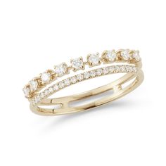 a yellow gold ring with three rows of diamonds on the side and an open band