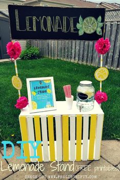 lemonade stand made out of pallet boards with flowers and lemons on it