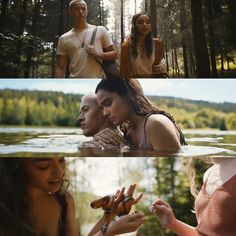 two people are in the water and one is holding something up to her face while another person looks on