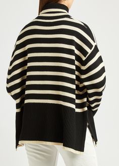 Long Description#Style Notes#Totême’s mission is simple: to design pieces like this black and cream jumper that transcend online trends. Taking inspiration from women’s lives and needs, the Stockholm-based label crafts this snug style from a blend of energy-saving organic cotton and wool before cloaking it in a striped pattern.#Info & Care# Totême black and cream wool-blend jumper Striped roll-neck dropped shoulders ribbed-knit trims side splits Slips on 56% wool 44% organic cotton #Size & Fit# Hand wash Length shoulder to hem: 25 inches/ 63.5cm Midweight Loose fit Model is 5'10"/ 178cm and wears a size small Cream Jumper, Striped Turtleneck, Black And Cream, Women Life, Roll Neck, Black Stripes, Ribbed Knit, Fitness Models, Wool Blend