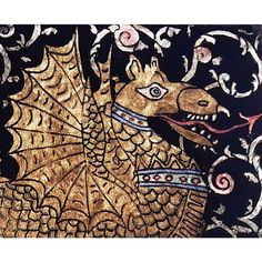 an intricately designed dragon on a black and gold background is featured in this image