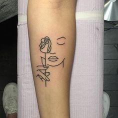 a woman's leg with a tattoo on it, and the word love is written in