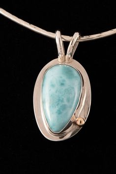 A gorgeous larimar pendant set with polished silver and a bronze bead accent. The blue green color of larimar is stunning and highlighted by the setting. Beautiful. Turquoise Larimar Cabochon Jewelry, Handmade Larimar Jewelry, Blue Green Color, Larimar Pendant, Doll Jewelry, Silver Jewelry Pendant, 925 Jewelry, Pendant Set, Green Color