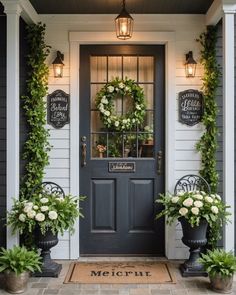 front door decorated with wreaths and flowers