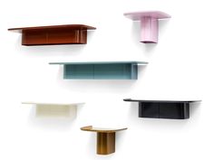 several shelves with different shapes and colors on them