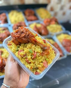 a person holding up a plastic container filled with food