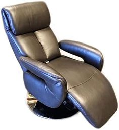 the reclining chair is made out of leather and has a foot rest on it