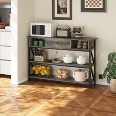 a kitchen area with a microwave, coffee maker and other items