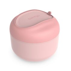 a pink container with the lid open on a white background, it is also used as an electric toothbrush holder