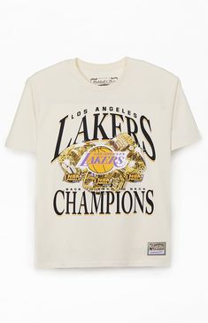 Treat yourself to a fresh pick from Mitchell & Ness with the new  Los Angeles Lakers Champions T-Shirt. This retro tee has a bold vibe with printed graphics on the front, a comfortable crew neckline, short sleeves, regular fit, and woven Hardwood Classics tag at the left hem.


	Crew neckline
	Short sleeves
	Standard fit
	Front graphic
	100% Cotton
	Machine washable Lakers Shirt Outfit, Vintage Cream Tops With Letter Print, Vintage College Tee, Cream Screen Print T-shirt For Streetwear, Retro Cream Tops With Graphic Print, Retro Cream Top With Graphic Print, Cream Graphic Print Top For Streetwear, Cream Logo Print Top For Streetwear, Vintage Cream Crew Neck T-shirt