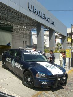 a police car parked in front of a building