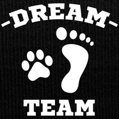 a black beanie with the words dream team written in white letters and an image of a foot