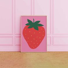 a pink wall with a strawberry on it in front of a wooden floor and white walls