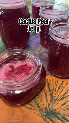 jars filled with jelly sitting on top of a table