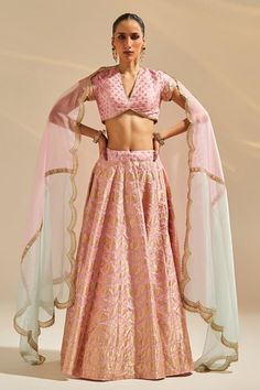 Pink attached cancan panelled lehenga with floral brocade woven motifs. Paired with V neck embroidered padded blouse and scallop embroidered dupatta.
Components: 3
Pattern: Woven
Type Of Work: Floral
Neckline: Plunge V neck
Sleeve Type: Cap sleeves
Fabric: Banarasi Silk
Color: Pink
Other Details: 
Attached inner lining
Lehenga:
Attached cancan
Floral pattern
Length: Approx. 43 - 47 inches
Weight: 1.5 kgs
Closure: Drawstring with zipper and hooks
Blouse:
Padded
Inverted V hem
Dupatta:
Semi sheer Semi-stitched Anarkali Sets In Brocade, Semi-stitched Anarkali Brocade Set, Floor-length Anarkali Brocade Set, Bollywood Style Brocade Designer Sets, Diwali Brocade Sets With Unstitched Blouse, Floor-length Brocade Sets For Diwali, Diwali Floor-length Brocade Sets, Anarkali Style Set With Unstitched Brocade Blouse, Eid Brocade Lehenga With Sheer Dupatta