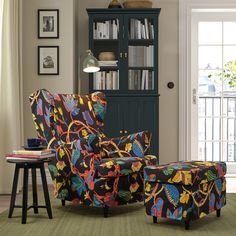 a colorful chair and ottoman in a living room