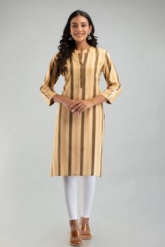 Looking for a stylish and comfortable addition to your wardrobe? Our Women's Plus Size Khadi Cotton Straight Stripe Kurti is perfect for you! Made from sustainable and breathable khadi cotton, this kurti is comfortable enough to wear all day long. The horizontal stripes and straight fit silhouette make it a versatile choice for any occasion, whether you're dressing up or going for a casual look. This kurti is available in a range of sizes from M to 7XL, ensuring that all women can find the perfect fit. The yellow color is perfect for adding a pop of color to your outfit, and the striped pattern adds interest and visual appeal. Not only is this kurti stylish, but it's also sustainable and environmentally friendly. Khadi cotton is a traditional fabric that is hand-spun and hand-woven, making Casual Long Sleeve Beige Kurta, Casual Beige Long Sleeve Kurta, Beige Long Sleeve Casual Kurta, Casual Straight Kurta For Work, Oversize Dress, Kurta For Women, Traditional Fabric, Oversized Dress, Horizontal Stripes