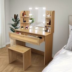 a bedroom with a bed, desk and mirror