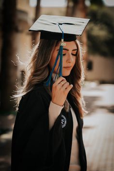 a woman wearing a graduation cap and gown