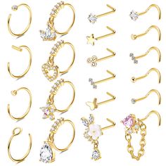 various types of piercings and rings on a white background