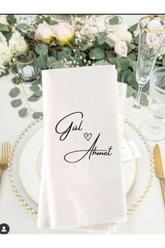 a place setting with napkins and silverware