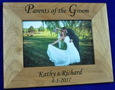 a wooden frame with the words parents of the groom on it and a photo of a bride and groom